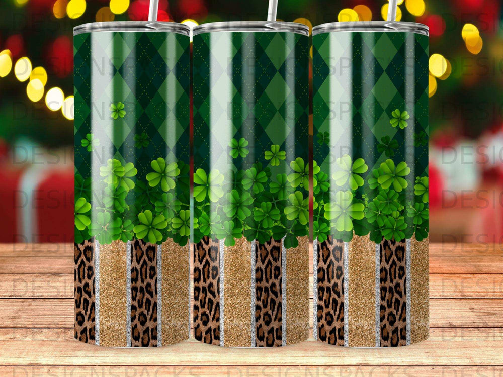 Three tall tumblers with green plaid and shamrock patterns, leopard print bands.
