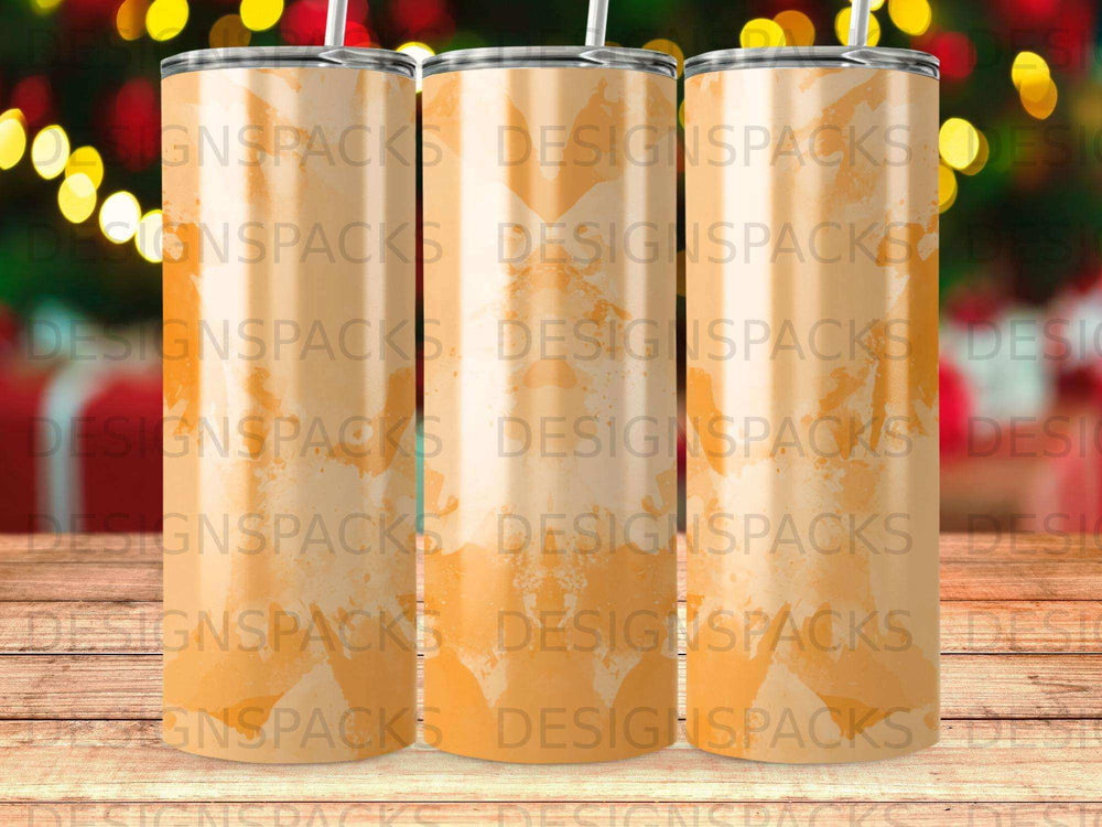 Three clear tumblers with orange sunset gradient and "DESIGNSPACKS" text.