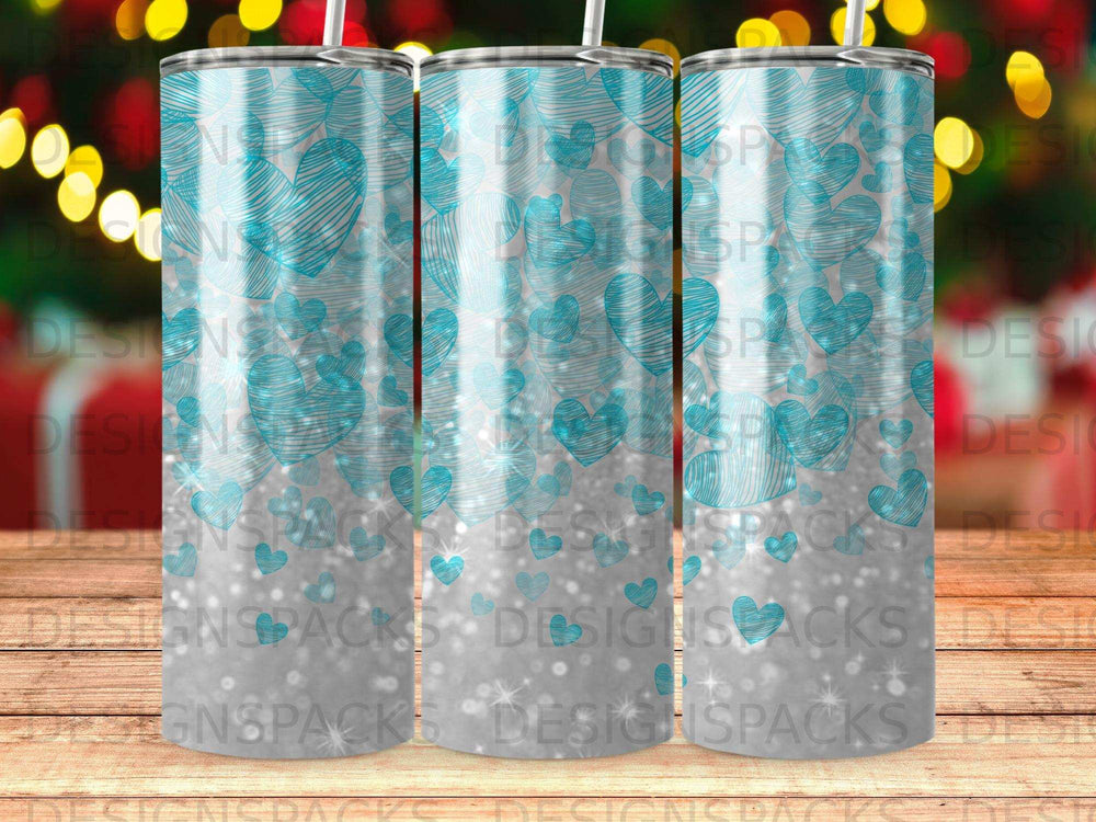 Tumbler with repeating turquoise heart pattern and silver glitter accents.