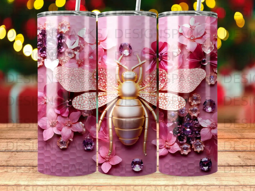 Gold bee with pink floral and gem design on a pink tumbler.