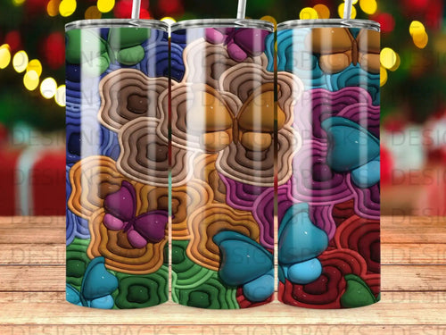 Three tumblers with a colorful, textured butterfly and swirl pattern.