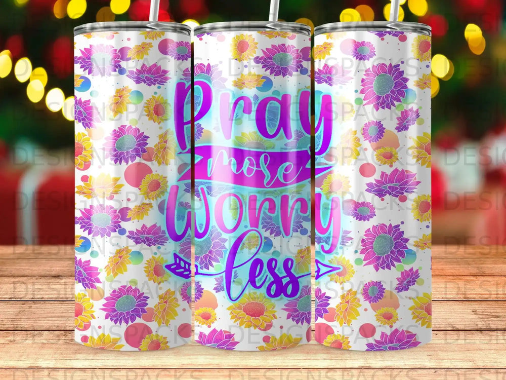 Tumbler with "Pray more, worry less" text and floral design.