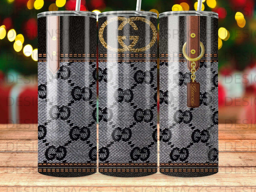 Gucci pattern tumbler with brown leather strap and GG logo.