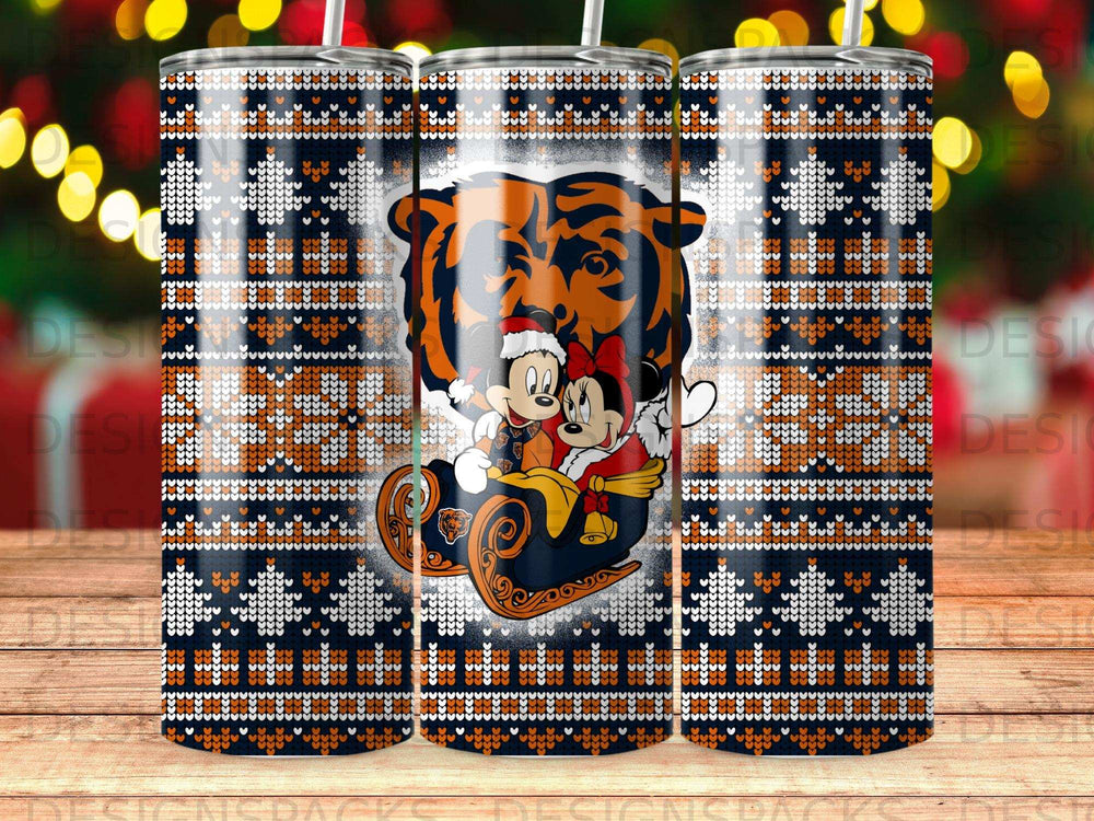 Mickey and Minnie in a sleigh with a bear on a festive holiday tumbler.