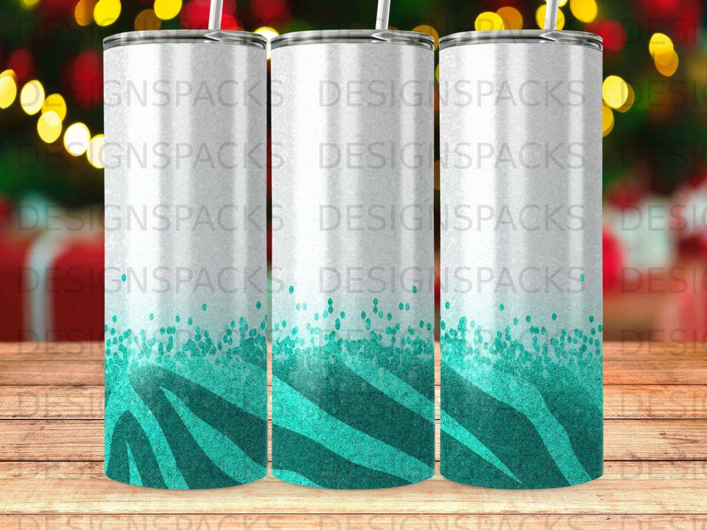 Three white tumblers with teal zebra print at the bottom.