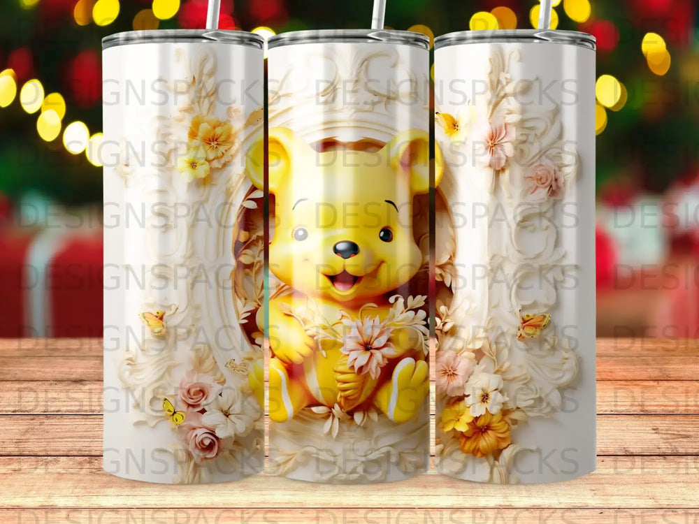 Winnie the Pooh character in ornate frame with flowers and butterflies on a tumbler.