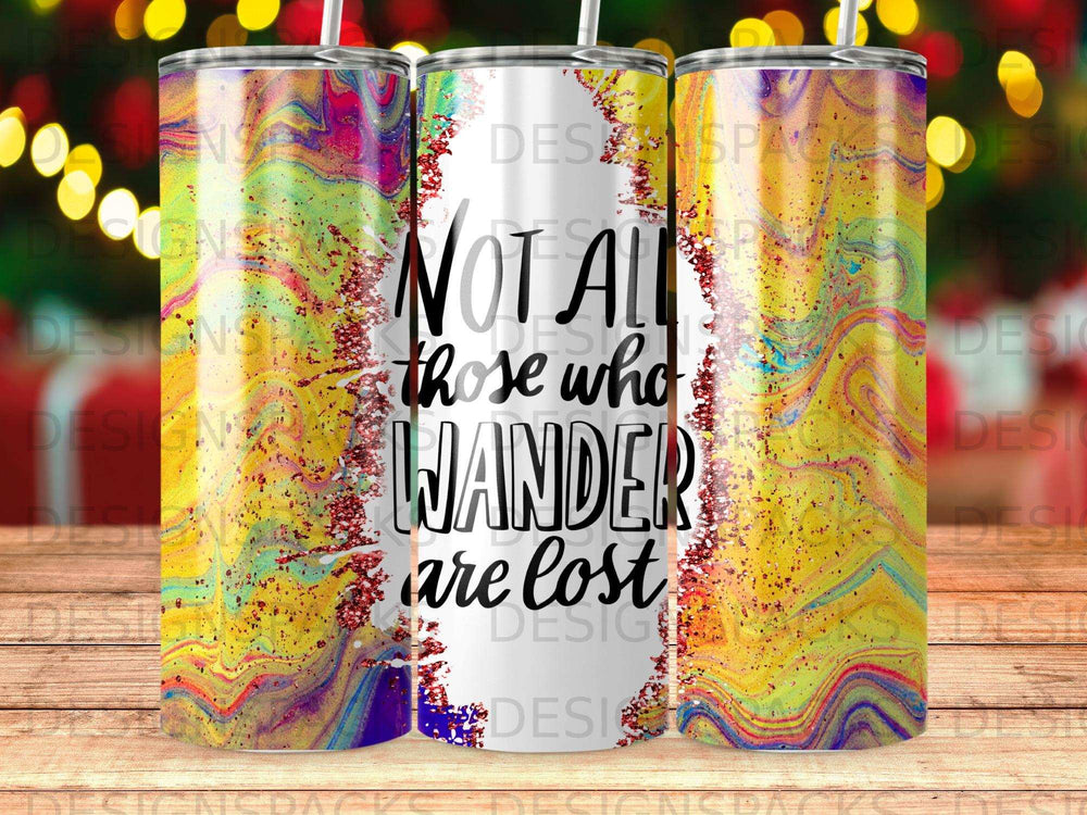 Tumbler with "Not all those who wander are lost" text and colorful glitter design.