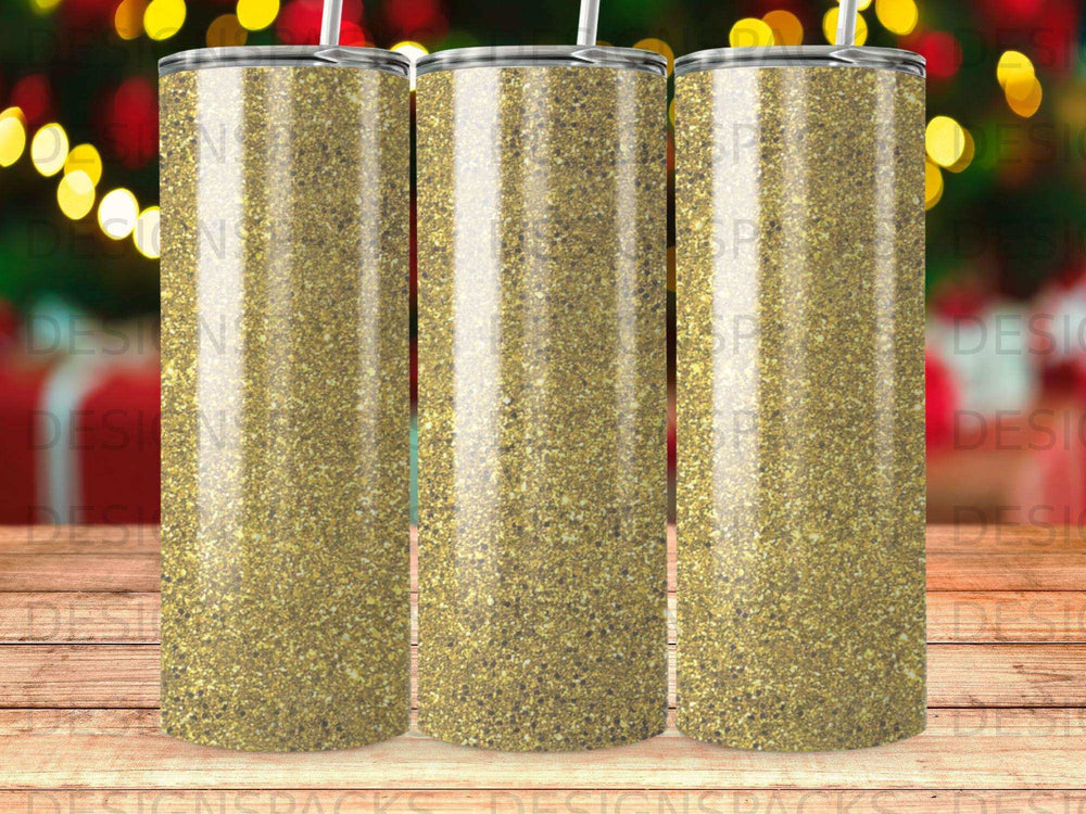 Three tumblers with a gold glitter design against a bokeh background.