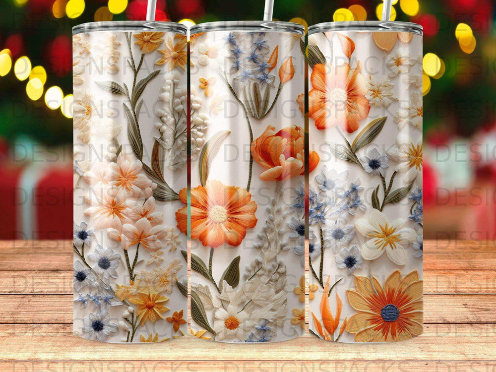 Floral tumbler with embossed orange and white flowers against a white background.