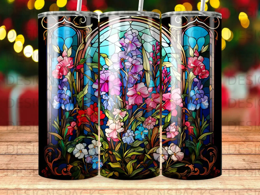 Stained glass tumbler with colorful floral design and dark border.