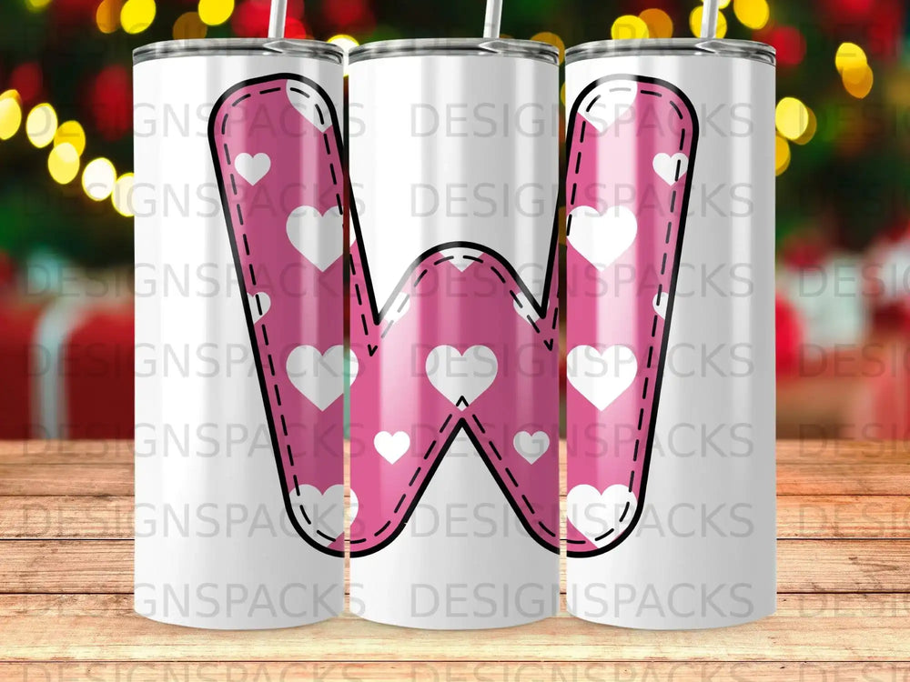 Pink monogram W tumbler with white polka dots and hearts.
