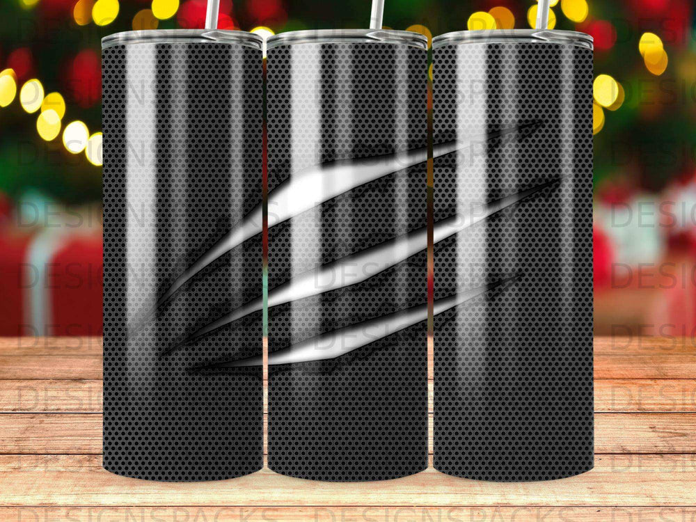 Black tumbler with silver claw marks and a textured background.