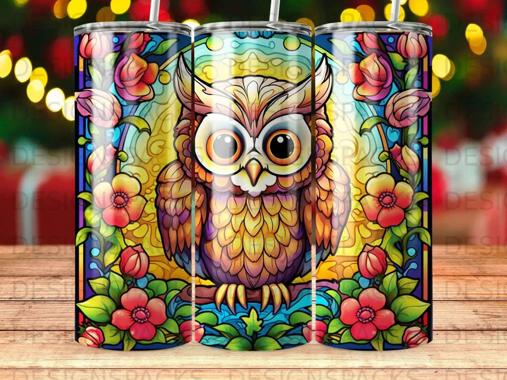 Stained glass owl with colorful flowers and vines.