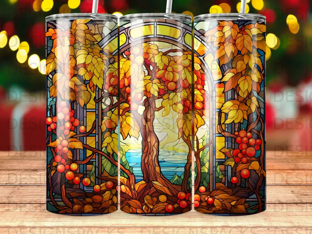 Stained glass window depicting autumn trees and fruit, with a landscape view.