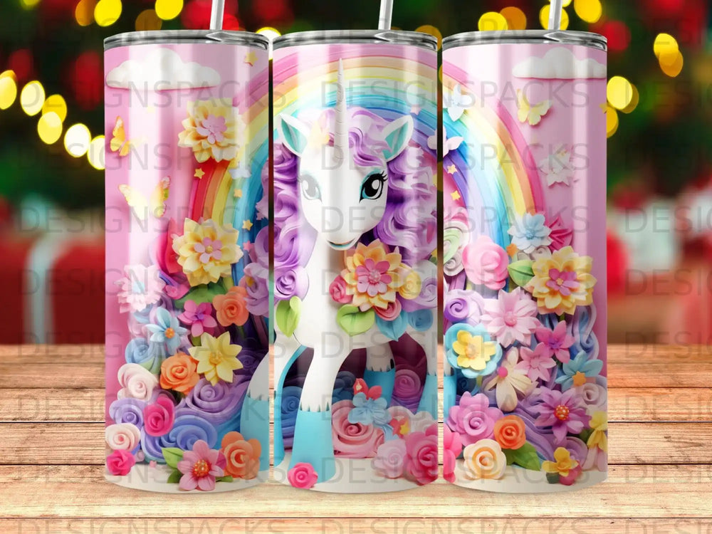 Unicorn with rainbow mane surrounded by vibrant flowers on a pink speckled tumbler.