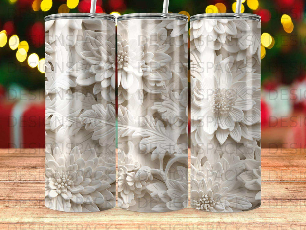White floral pattern on a tumbler with bokeh lights in the background.