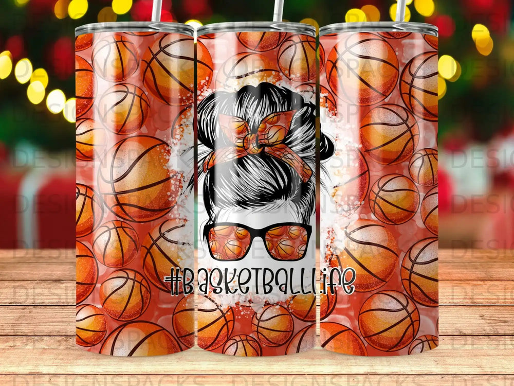 Tumbler with basketball pattern and woman wearing sunglasses with messy bun.