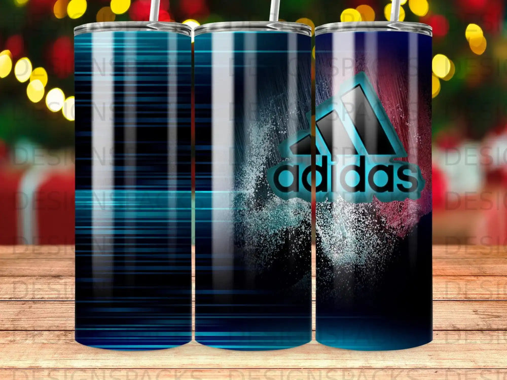 Adidas logo with blue stripes and speckles on a dark background.