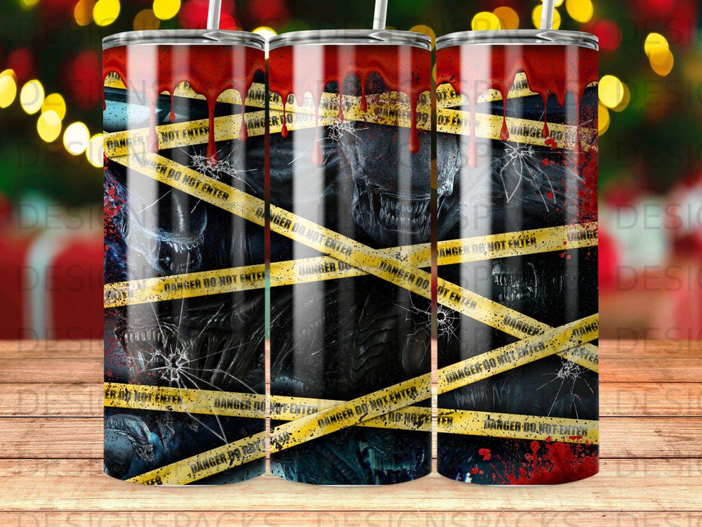 Alien creature with caution tape, on a patterned tumbler.
