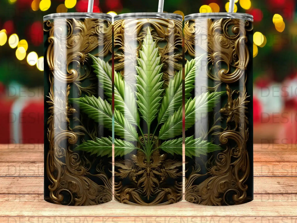 Tumbler with gold ornate pattern and central cannabis leaf design.
