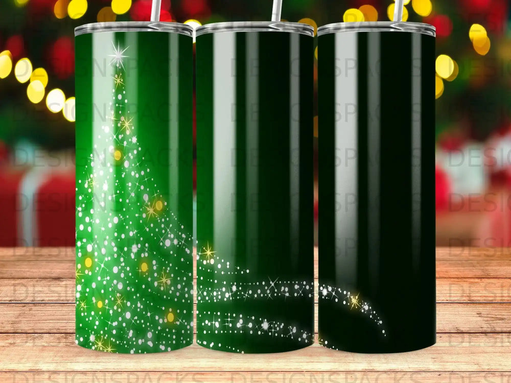 Green tumbler with sparkling Christmas tree and falling snow design.