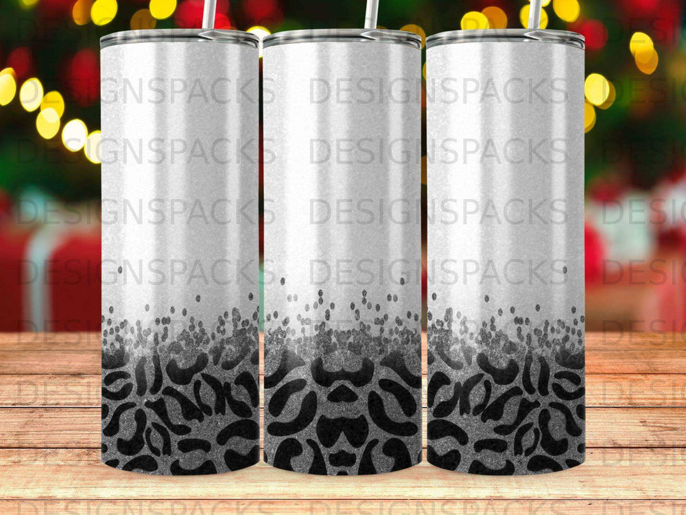 Three tumblers with leopard print design and glitter accents.