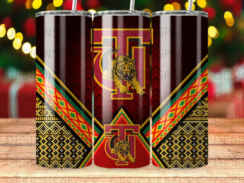 Three tumblers with a tiger and geometric patterns, two in focus.