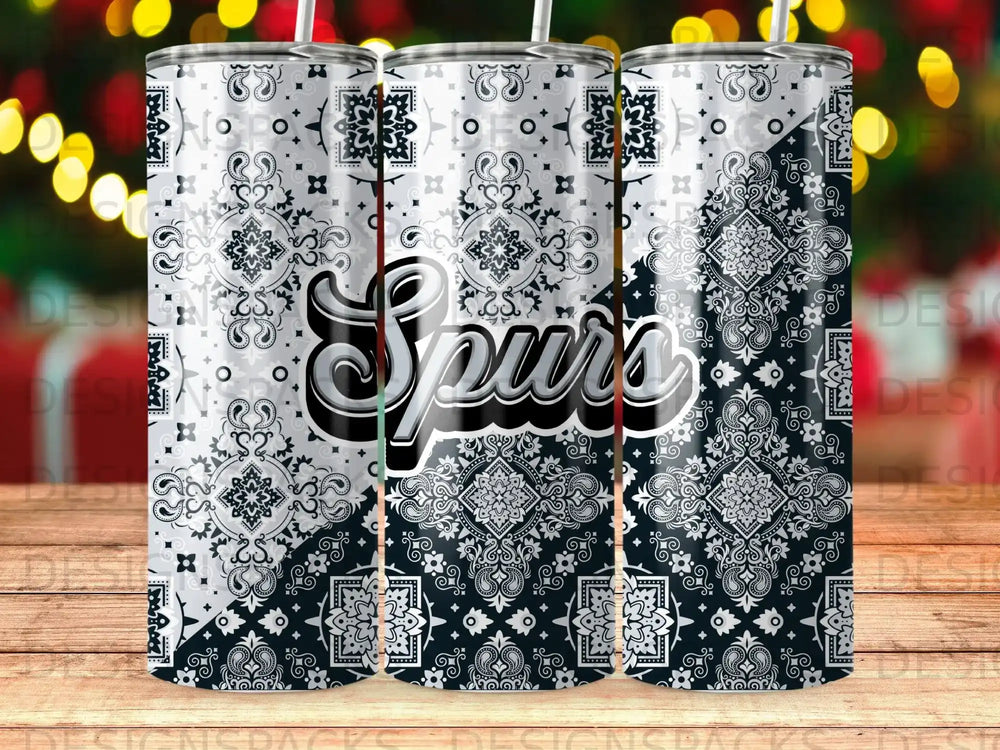 Black and white bandana pattern tumbler with "Spurs" text.