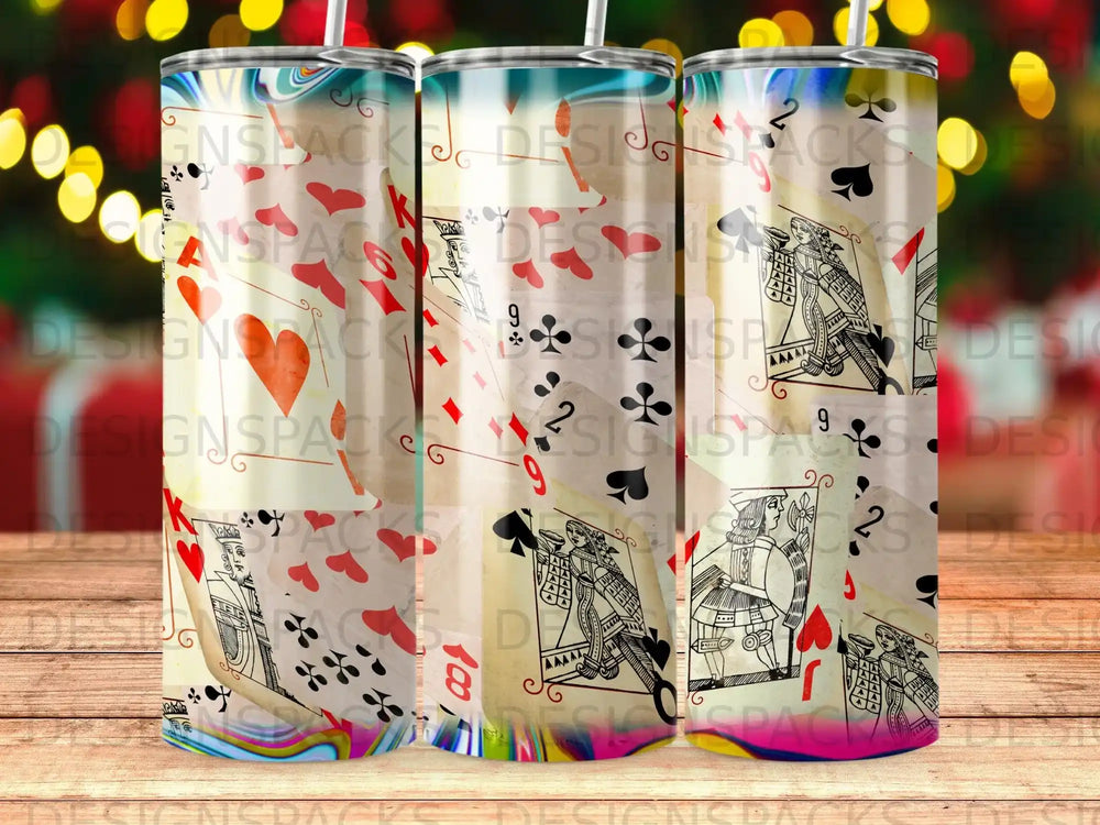 Playing cards pattern on a tumbler with bokeh lights background.