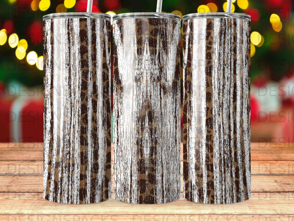 Three tall tumblers with a brown and white wood grain and leopard print design.