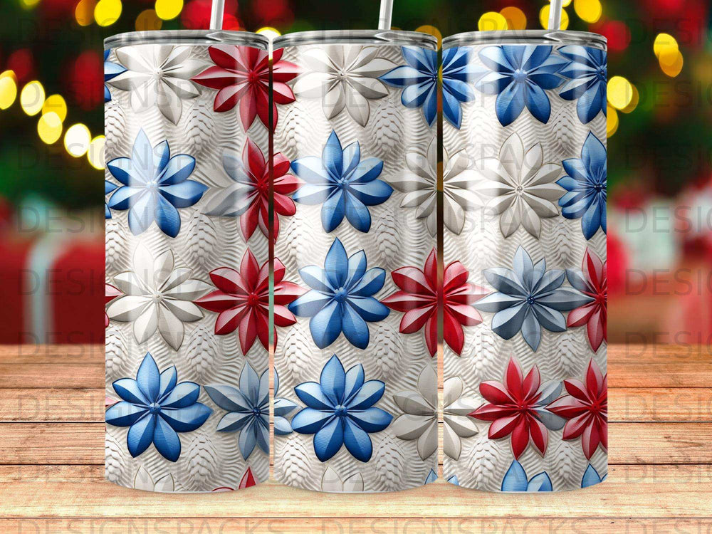 Three tall tumblers with repeating red, white, and blue floral patterns.