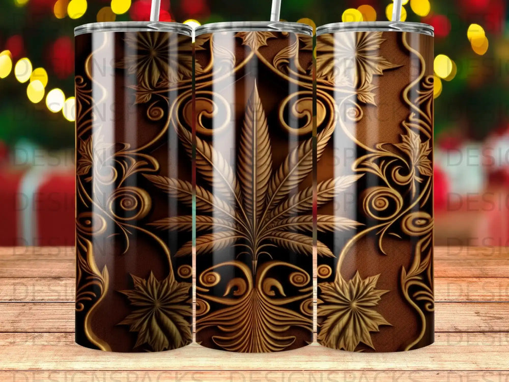 Brown tumbler with gold cannabis leaf and ornate scrolling pattern.