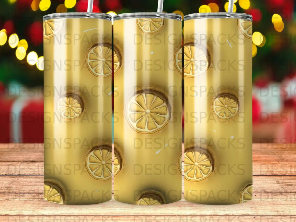 Tumbler with repeating yellow lemon slice pattern and "DESIGNSPACKS" text.