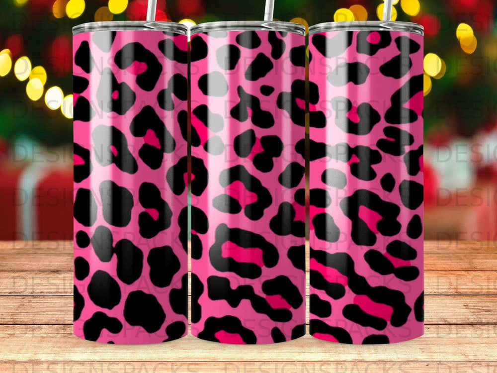 Pink and black leopard print tumbler with a bokeh background.