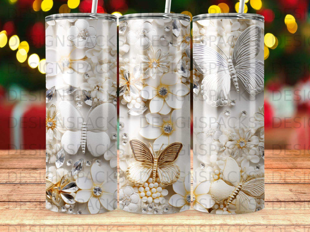 White and gold floral and butterfly design on three tumblers.