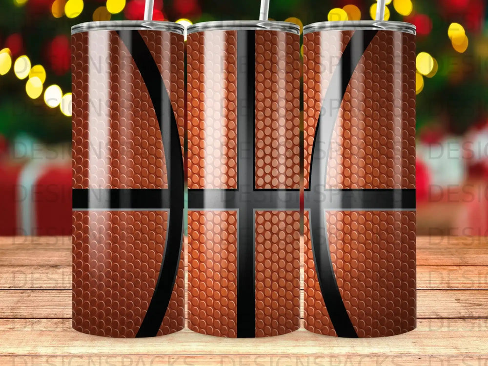 Close-up of three tumblers with a basketball texture and design.