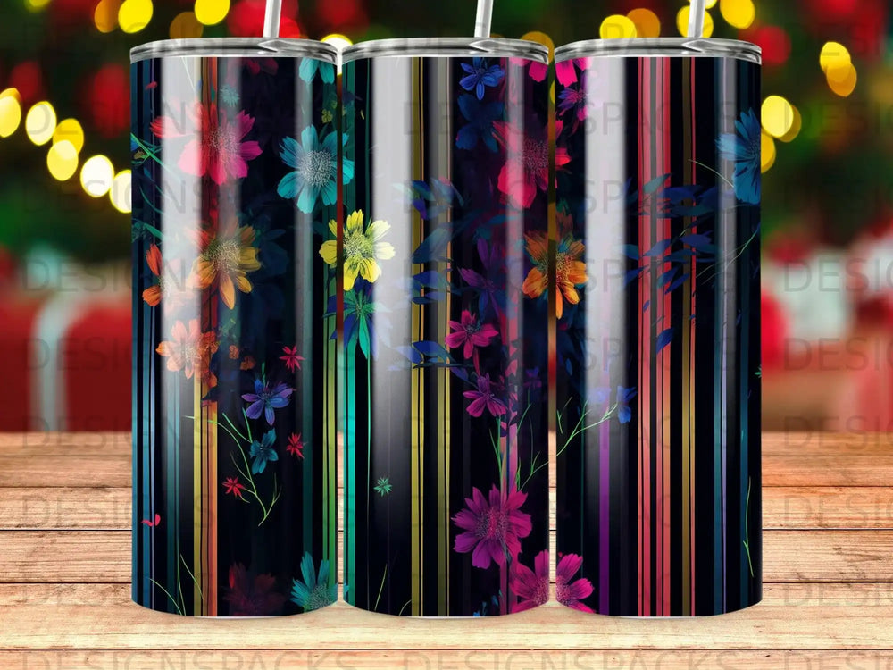 Tall tumbler with colorful floral pattern on striped background.