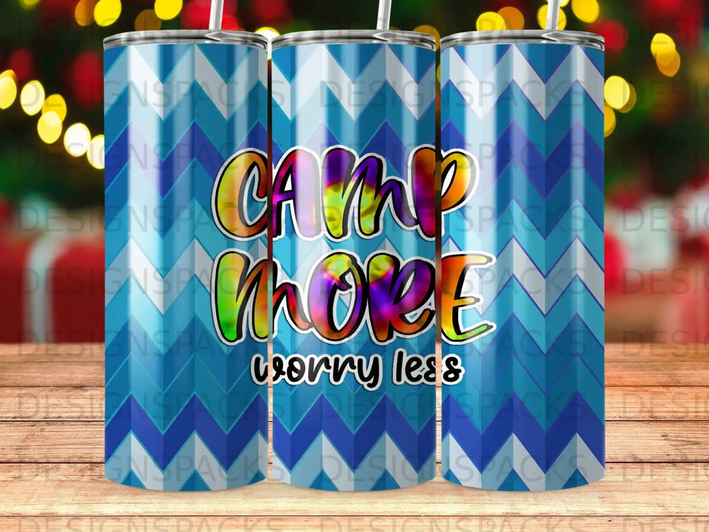 Tumbler with "Camp More, Worry Less" text against a blue and green abstract background.