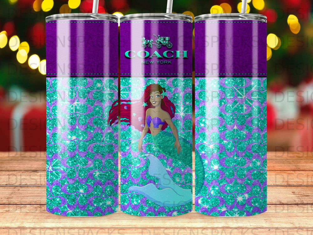 Coach New York mermaid design on a glittery purple and teal patterned tumbler.