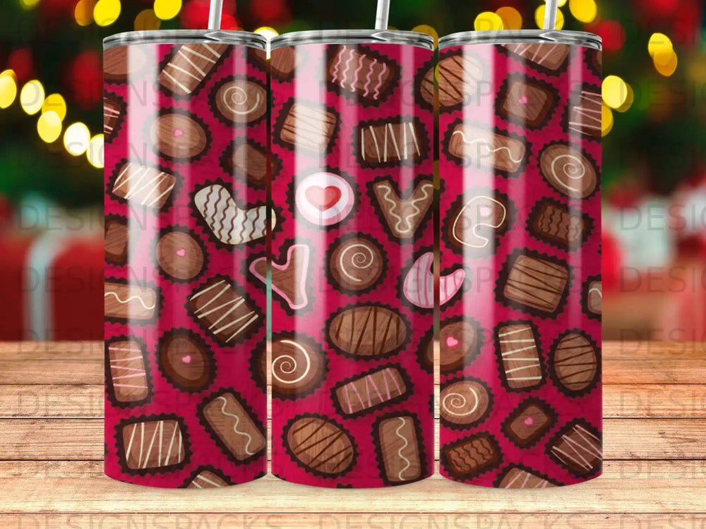Assortment of chocolate candies with swirling patterns and heart shapes on dark pink background.
