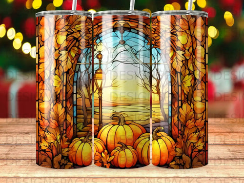 Three tumblers with a fall harvest stained glass design featuring pumpkins and autumn leaves.