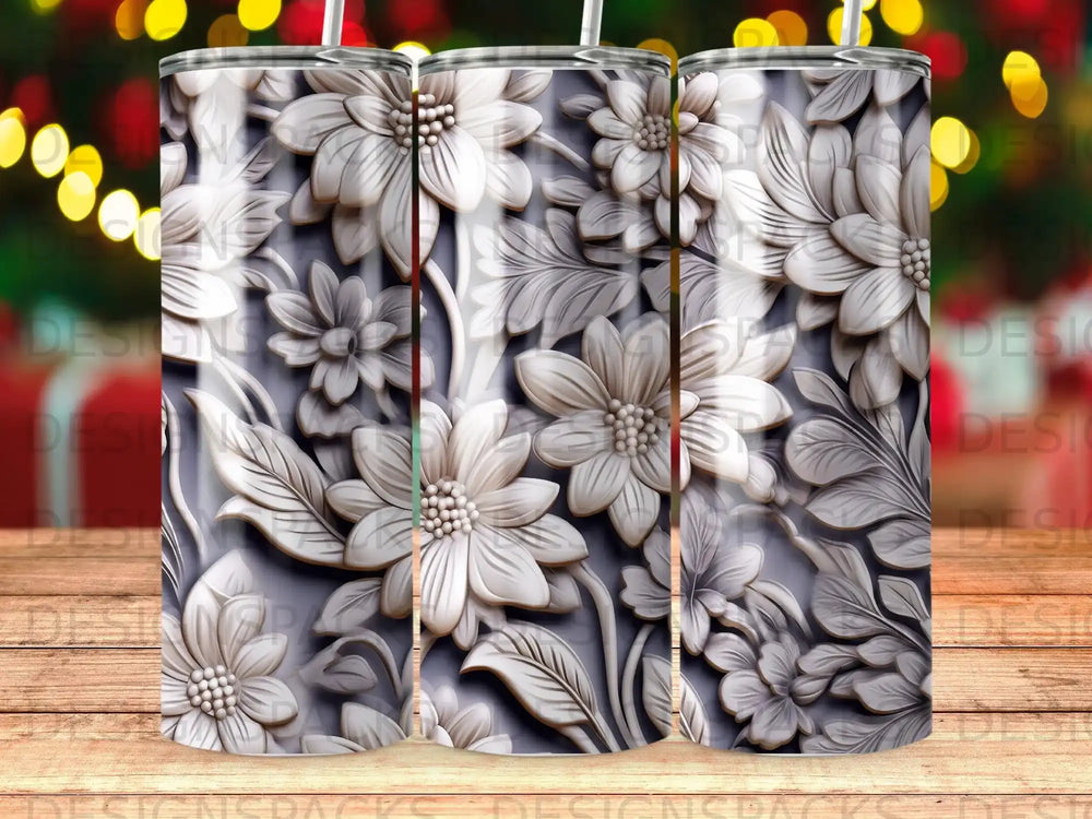 White embossed floral pattern on a grey background, three tumblers shown.