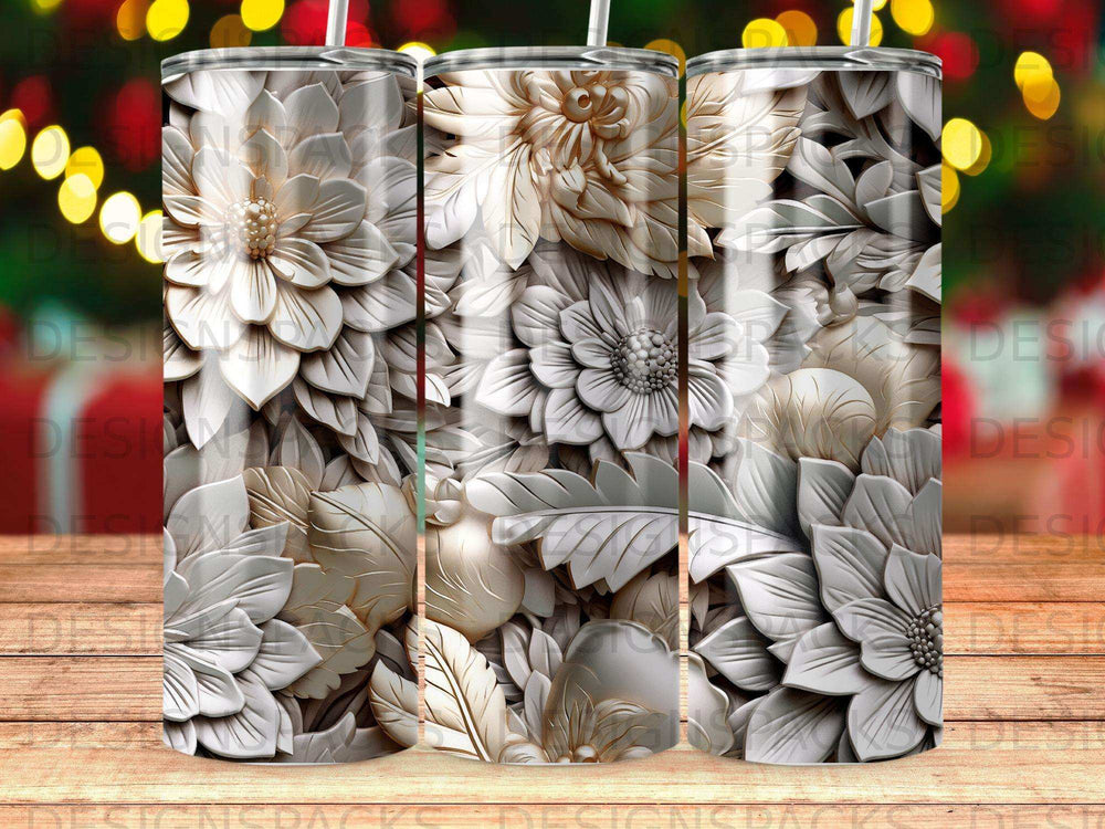 Three tumblers with intricate floral embossed white and tan designs.