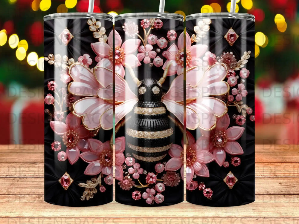 Black tumbler with a pink floral and jeweled bee design.