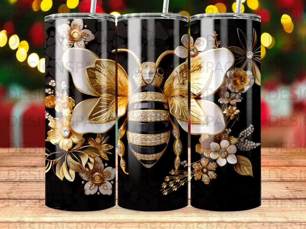 Gold bee and floral design on a black tumbler.