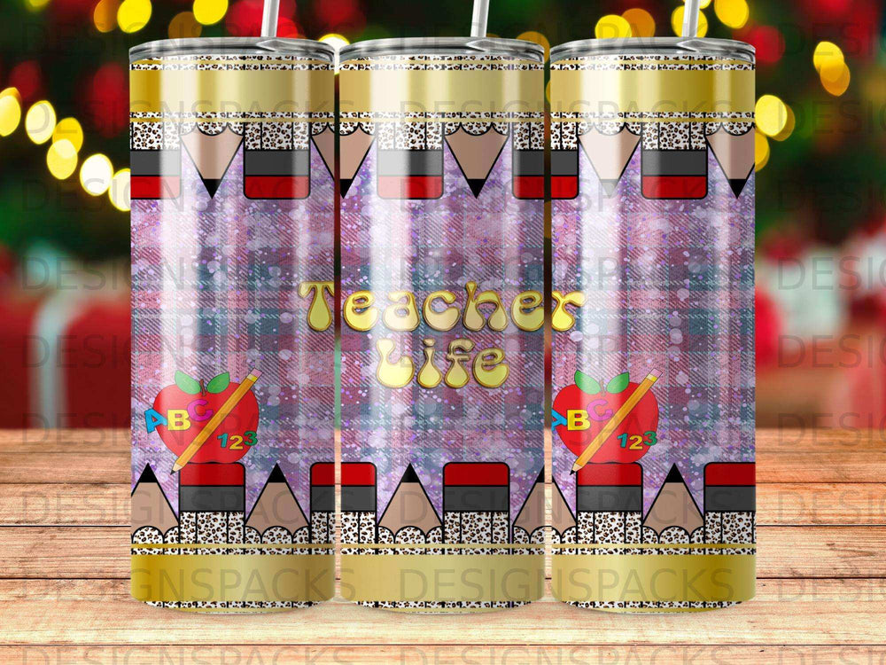 Teacher Life tumbler with apples, ABCs, and pencils, patterned background.