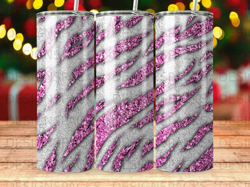 Tumbling tumbler with pink glitter tiger stripes on a gray textured background.
