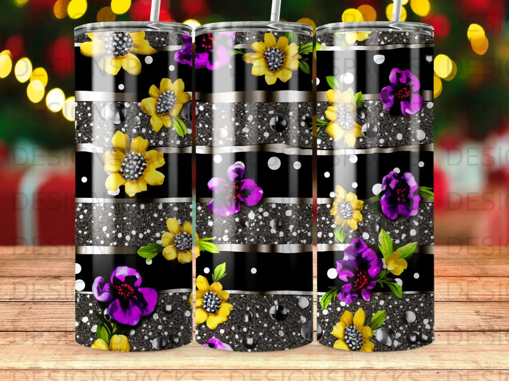 Black striped tumbler with yellow and purple floral design and glitter accents.