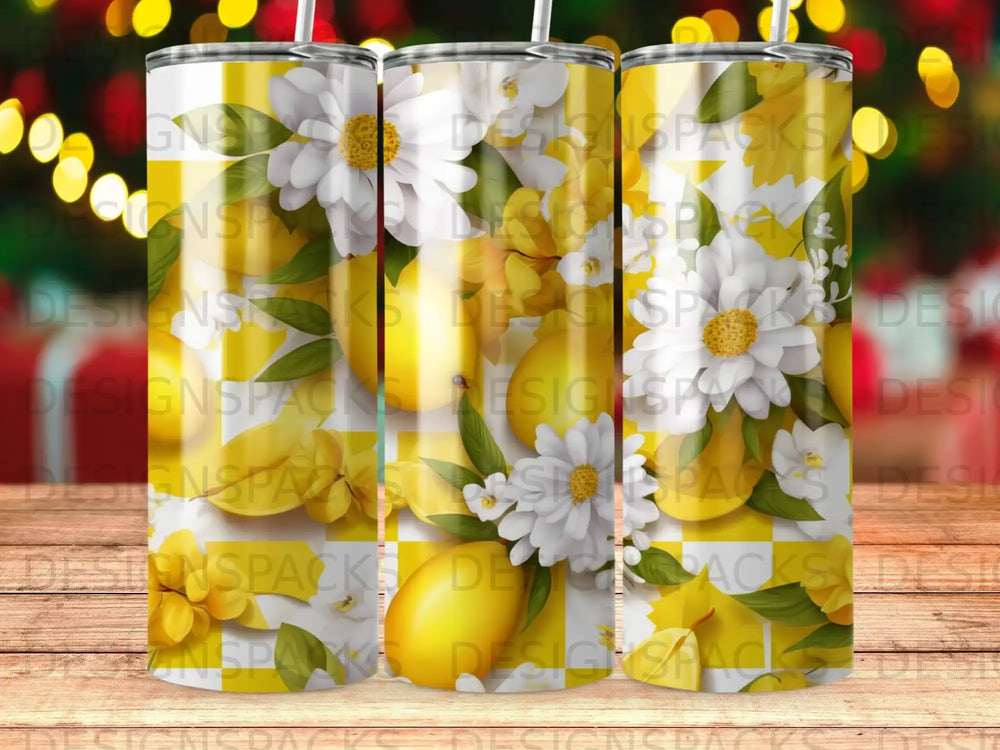 Yellow lemons and white daisies on a patterned tumbler.