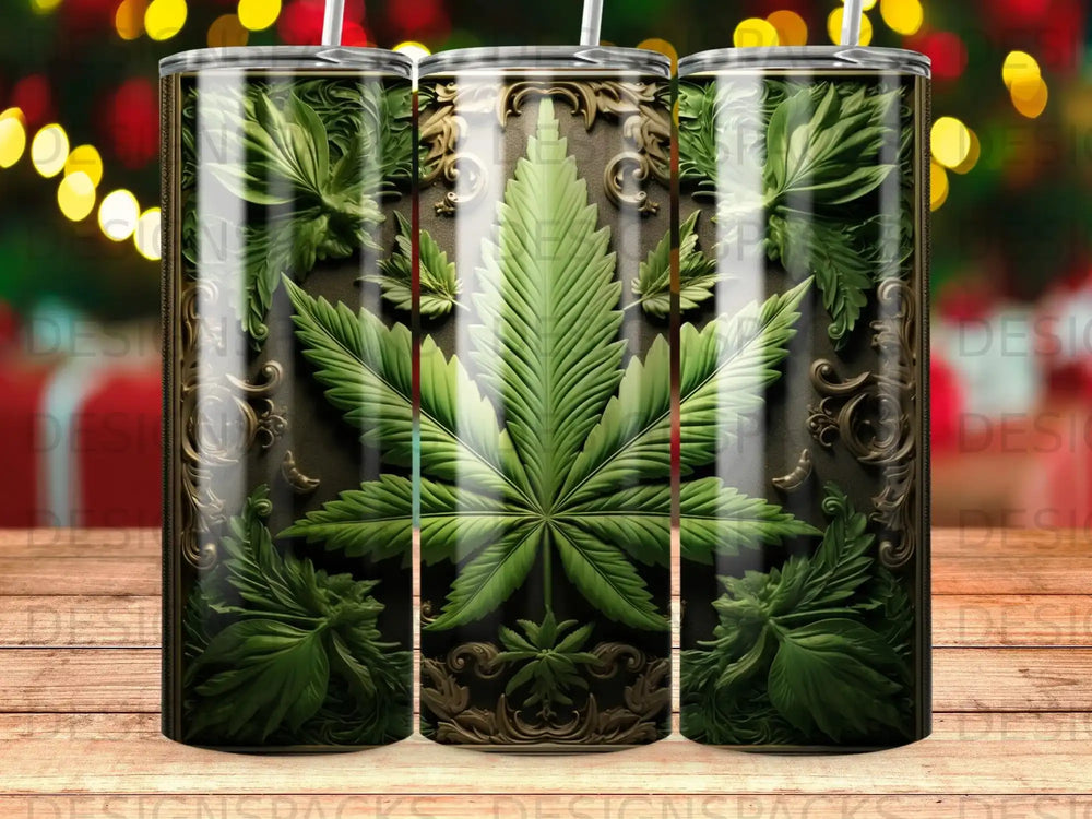 Cannabis leaf design on a metallic tumbler with ornate scrollwork.